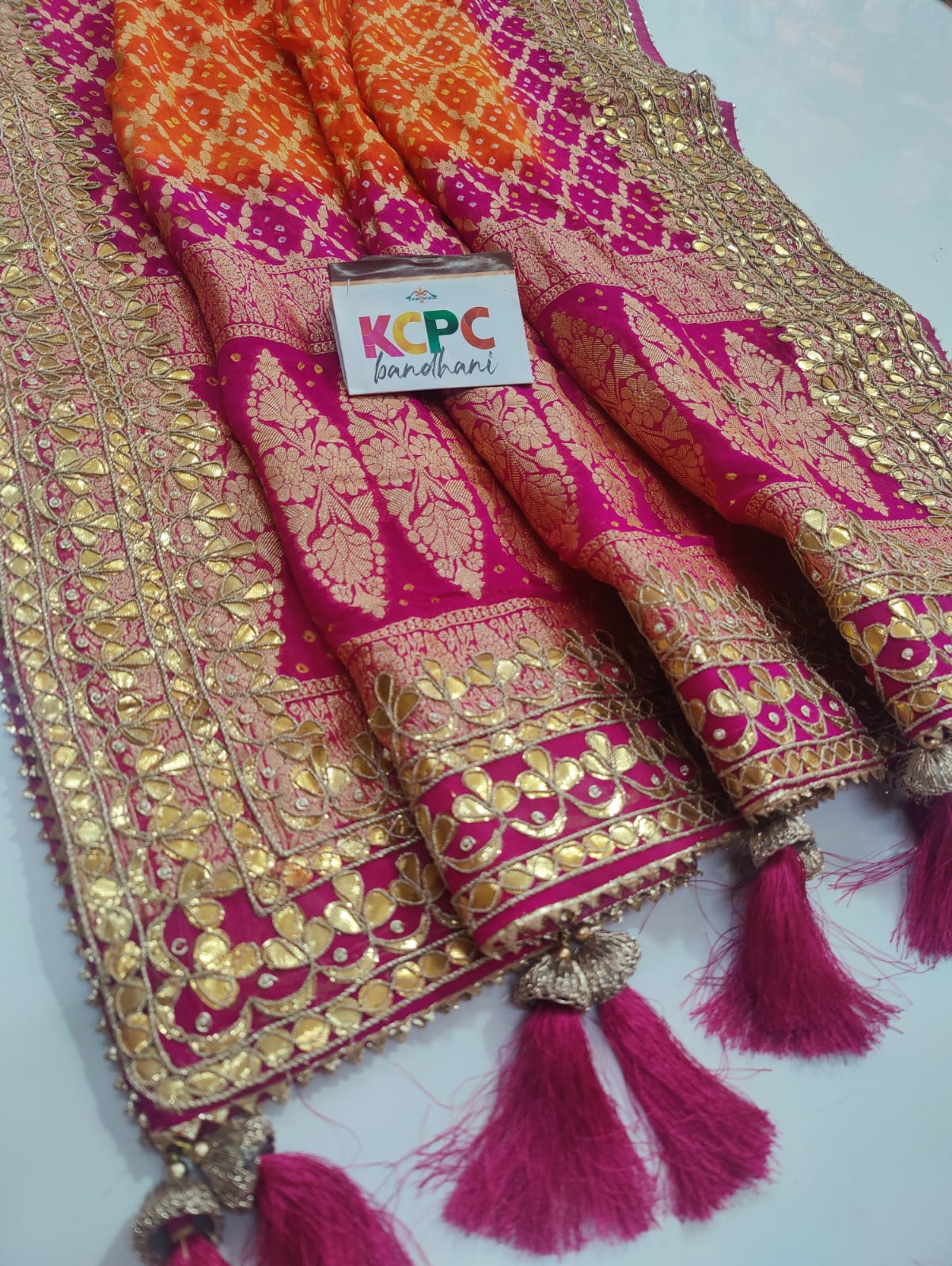 Pure Khaddi Upada Jangla Neemzari Bandhani

Ghatchola Dupatta With Gotapatti Handwork   Orange Rani